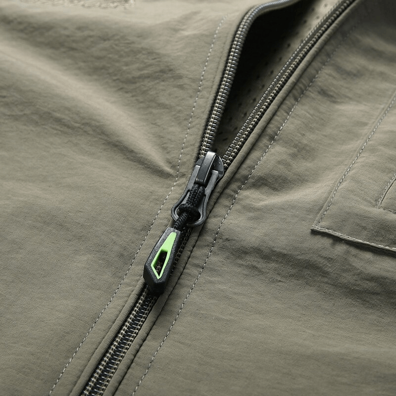 Close-up of the zipper on a casual stand collar men's vest in khaki color, featuring a sleek, modern design for versatile style.